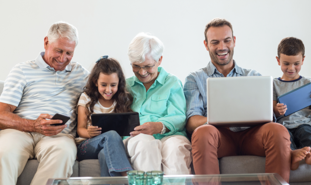 Diverse group of people using digital devices, representing digital inclusion and accessibility.
